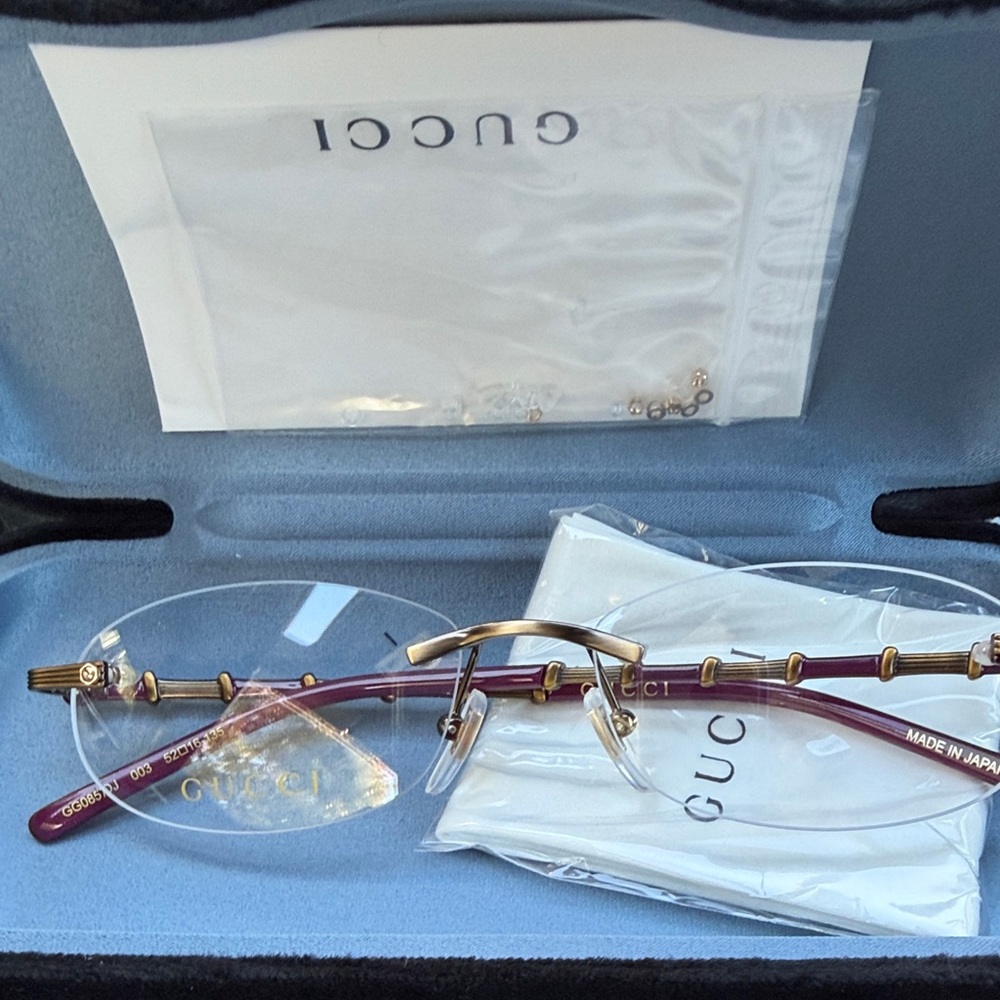 Gucci Gold and Purple Rimless Glasses